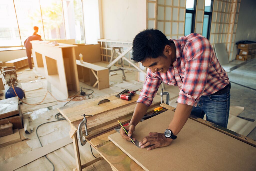 Man smiling in a construction building
