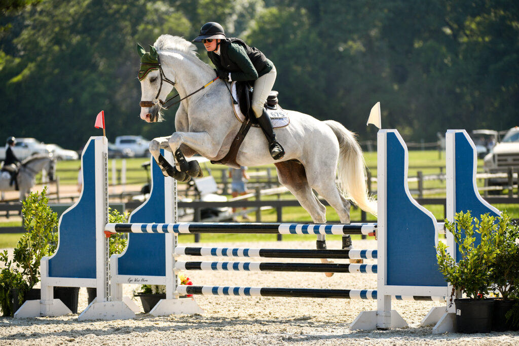 person on a horse jumping